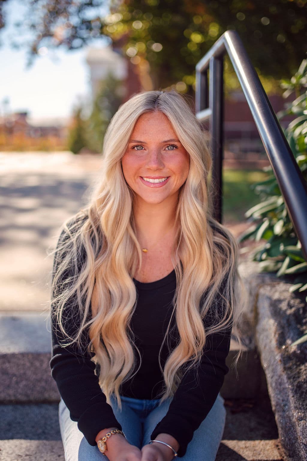 Smiling woman headshot in natural light outdoors